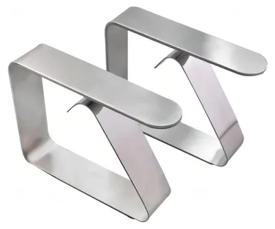 Two silver metal table cloth clips are shown against a white background.