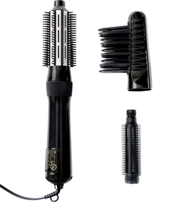 A black hair styling tool with multiple attachments is displayed against a white background.