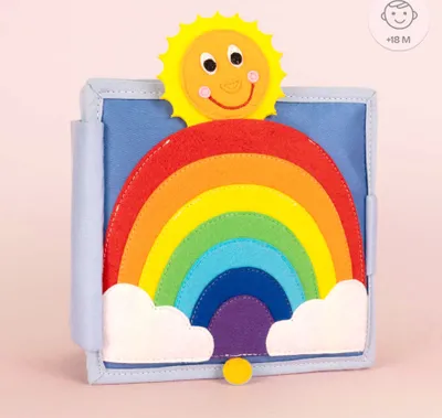A children's felt book featuring a sun and rainbow.