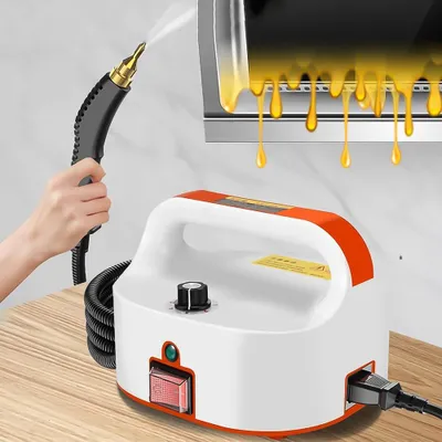 A hand holding a steam cleaner wand sprays steam onto a surface with yellow liquid dripping down.