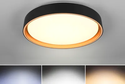 A modern LED ceiling light with a black frame and a gold accent ring, illuminated against a light gray ceiling.