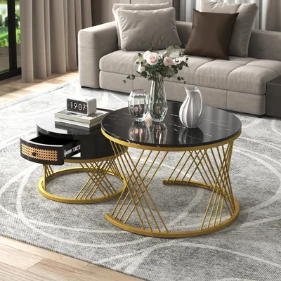 A stylish living room setting with a modern sofa and a pair of nesting coffee tables.