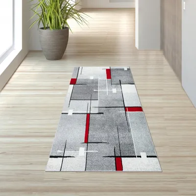 Zdjęcie produktu dla Nowoczesny dywan z krótkim włosiem, z wzorem w linie w kolorach szarym, białym i czerwonym, przeznaczony do wnętrz. Wymiary: 80 x 140 cm
