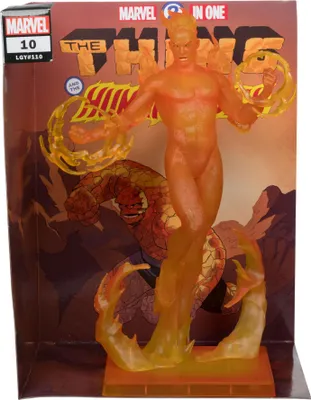 A Marvel collection PVC statue of the Human Torch is displayed in its packaging, which features artwork of the Fantastic Four.