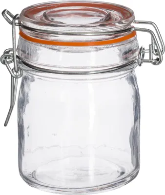 A clear studio shot of an empty glass jar with a clamp lid.