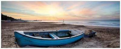 Produktbild von Wallario Wandbild aus Acryl, 200 x 80 cm, freischwebende Optik - Fischerboot am Strand bei Sonnenuntergang