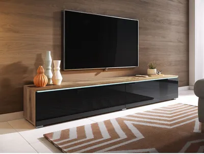 A modern living room setup with a TV stand and television.