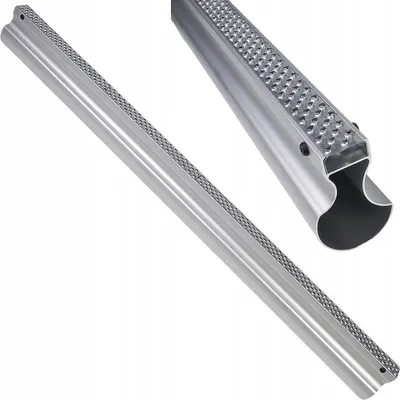 A close-up, angled view of a long, silver metal tool with a textured surface along one edge, set against a white background. A smaller inset image shows a closer view of the textured end of the tool.