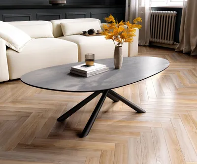 Produktbild von DELIFE Couchtisch Edge Oval 140x75 cm Keramik Beton Grau Sarity Metall Schwarz