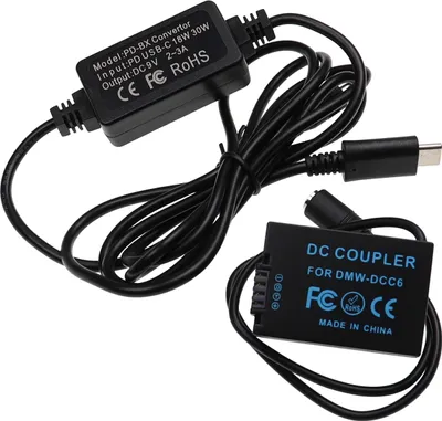 Produktbild von vhbw USB Netzteil kompatibel mit Panasonic Lumix DMC-FZ62, DMC-FZ45, DMC-FZ72, DMC-FZ48 Kamera, Digitalkamera + DC Kuppler (Ersatz für DMW-DCC6), 2m
