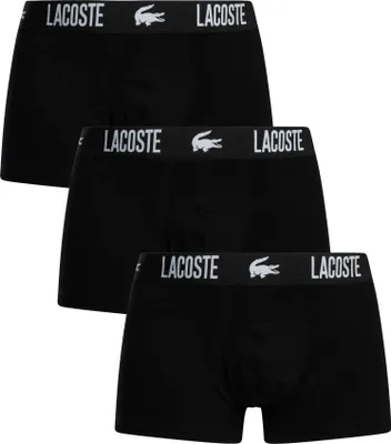 Three black Lacoste boxer briefs are stacked on top of each other.