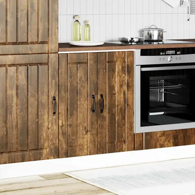 A kitchen scene showing wooden cabinets and a built-in oven.