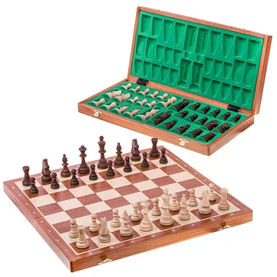 A wooden chess set with pieces on the board and pieces stored in the open box.