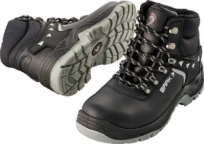 A pair of black work boots with gray soles and laces, shown from a diagonal angle against a white background.
