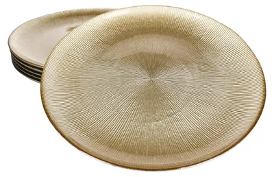 A stack of gold-colored glass plates with a textured pattern.