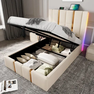A bed with its storage compartment open, showing stored items. The bed has LED lighting on the headboard.