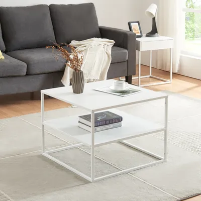 A modern living room scene with a couch, coffee table, and side table.