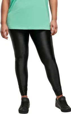 A person wearing black leggings and a mint green shirt.