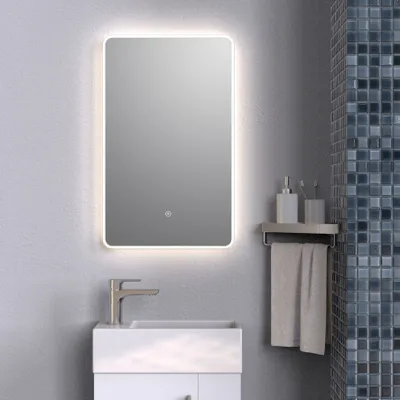 A modern bathroom vanity with a mirror and sink.