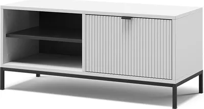A white shoe cabinet with a fluted door and black legs, shown against a white background.