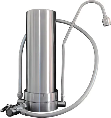 A stainless steel countertop water filter with hoses and a faucet attachment, isolated on a white background.