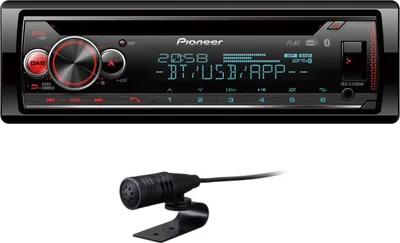 A car stereo and a microphone are shown against a white background.