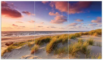 Produktbild von Wallario Herdabdeckplatte aus Glas, Größe 90 x 52 cm 3-teilig, Motiv Abendspaziergang am Strand - Sonnenuntergang über dem Meer