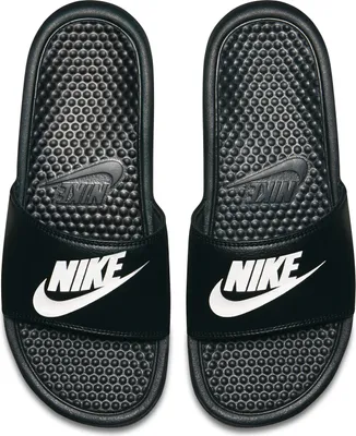 A pair of black Nike Benassi JDI slides with white Nike logos.