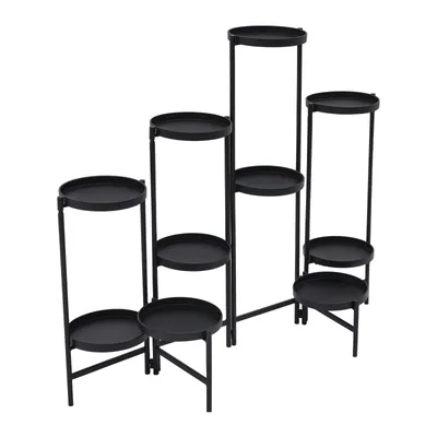 A black metal plant stand with multiple tiers.