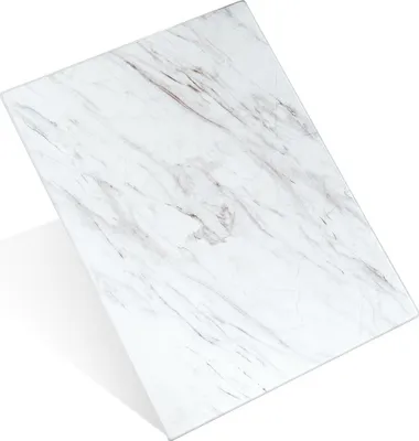 A white glass cutting board with marble-like veining, shown at an angle on a white background.
