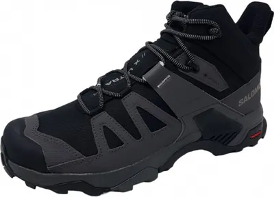 A single black and gray Salomon hiking boot is shown against a white background.