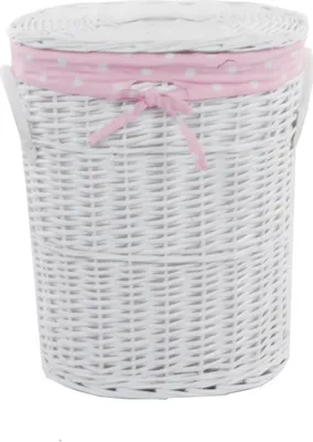 A white wicker laundry basket with a pink polka dot fabric liner and bow.