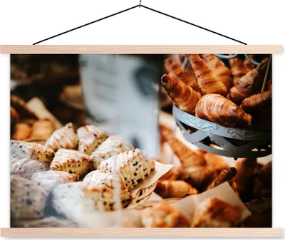 Produktbild von MuchoWow® Textilposter Das Gebäck im Schaufenster des Bäckers 120x80 cm mit holzfarbenen Rahmen - Aufhängeset