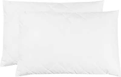 Two white quilted pillows are shown side-by-side on a white background.