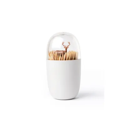 A white toothpick dispenser with a clear dome containing a small deer figurine and toothpicks.