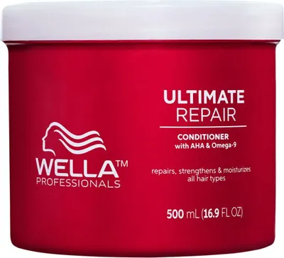 A red tub of Wella Professionals Ultimate Repair Conditioner.