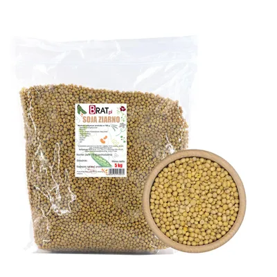 A bag of soybeans next to a wooden bowl filled with soybeans.
