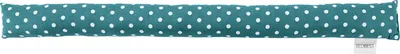 A long, cylindrical draft stopper with a teal background and white polka dots, lying horizontally on a white background.