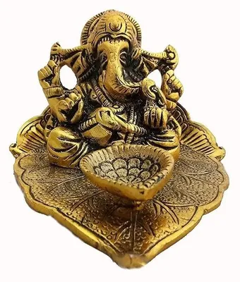 Produktbild von Ganesha-Statue auf einem Blatt mit einer Diya (Öllampe)