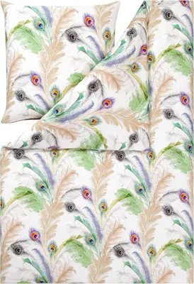 A flat lay of bedding with a peacock feather pattern.