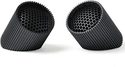 Two black cylindrical speakers with a honeycomb pattern inside are shown on a white background.