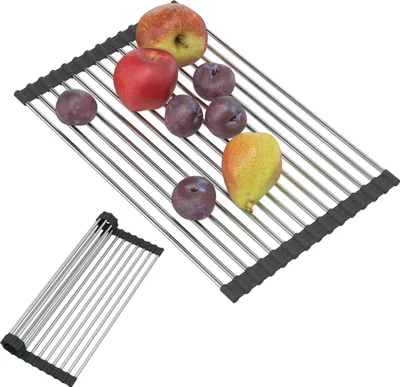 A roll-up dish drying rack with various fruits on it, and a smaller, rolled-up rack in the foreground.