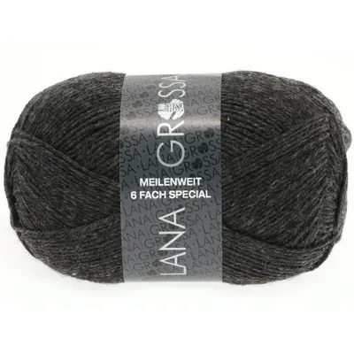 A ball of dark gray yarn with a label wrapped around it.