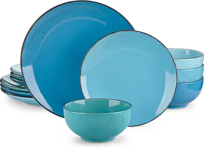 A set of blue ceramic plates and bowls are arranged on a white background.