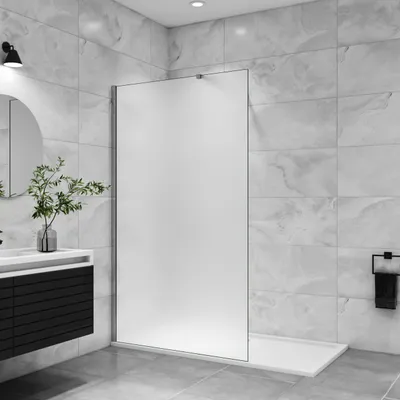 A modern bathroom with a walk-in shower, vanity, and mirror.