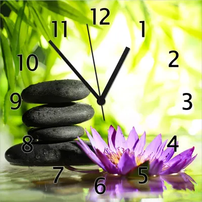 Produktbild von Wallario Design Wanduhr Steinstapel in schwarz mit Blumenblüte in lila aus Echtglas, Größe 30 x 30 cm