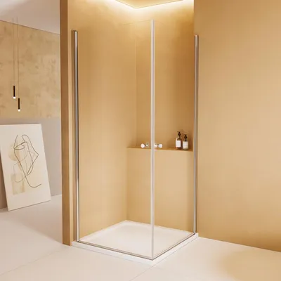 A modern bathroom corner with a glass shower enclosure.