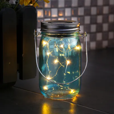Produktbild von LED Solar Glas - Windlicht - mit Drahtlichterkette - Lichtsensor - H: 14cm - D: 8cm - blau