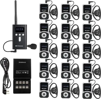 A collection of Retekess T130S tour guide systems and a charging dock.