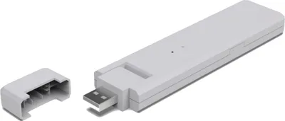 A white USB communication module with its cap detached, shown on a white background.